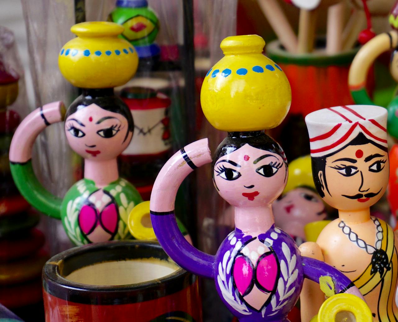 gallery-04 Vibrant hand-painted wooden figurines reflecting traditional Indian culture.